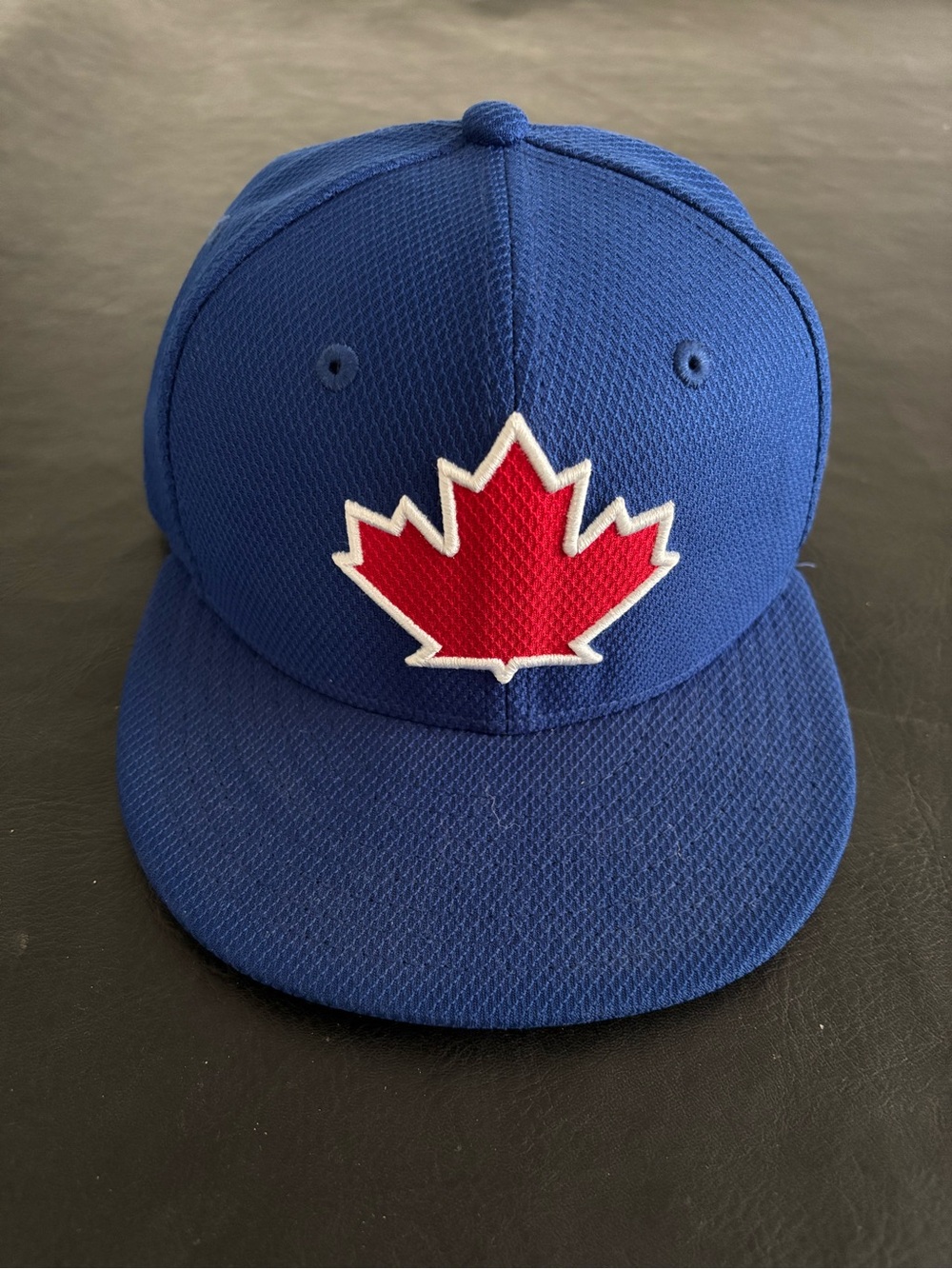 New Era Blue Cap with Red Maple Leaf Patch